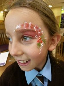 Christmas face painting at a Christmas market in Stow-on-the-wold