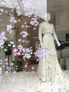 Hand painted cherry blossom shop window display mural in Cheltenham.