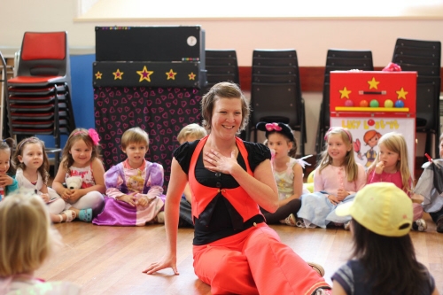 Lucy the magician performing her show.