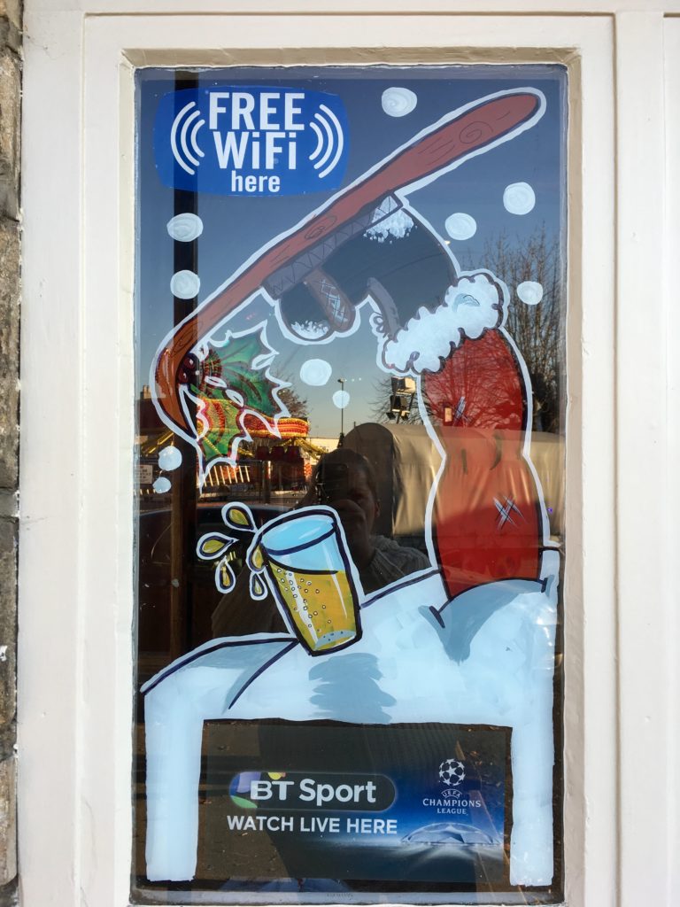Father Christmas legs window display Stroud