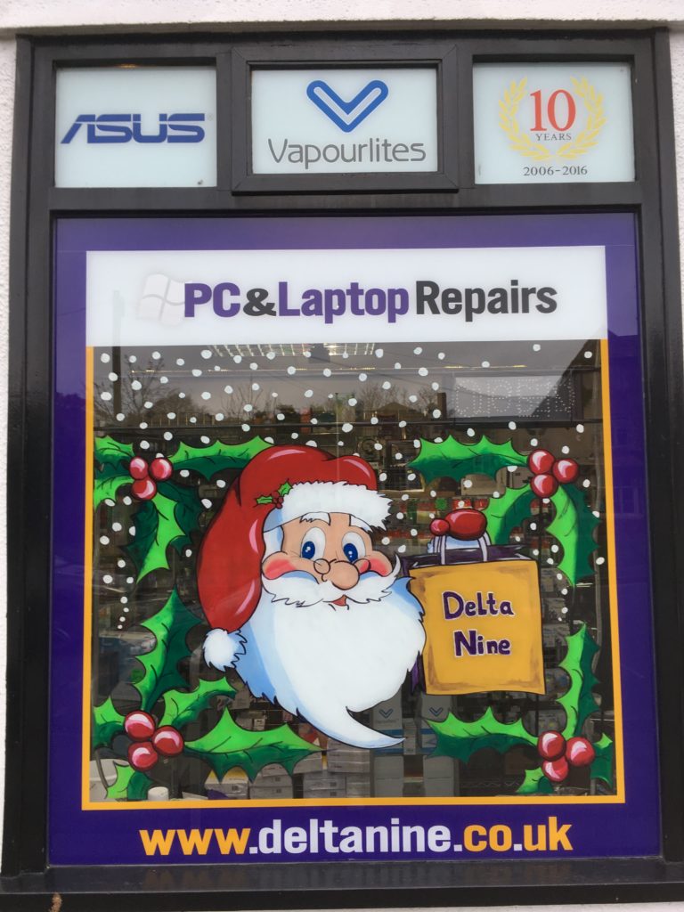 Father Christmas shopping window display seasonal Cheltenham