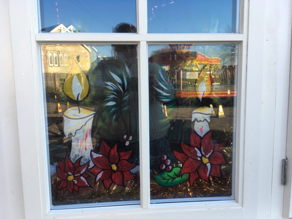Christmas candle shop window pub display