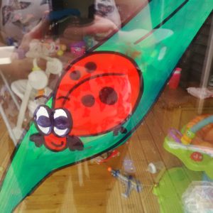 ladybird nursery window mural display Cheltenham