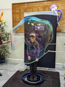 child inside a giant bubble bristol
