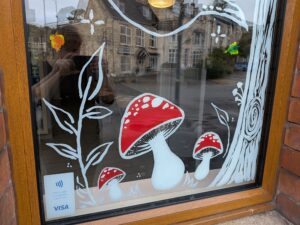 Window painting for Autumn fall with mushrooms and leaves
