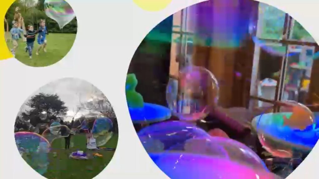 Children watching a giant bubble show